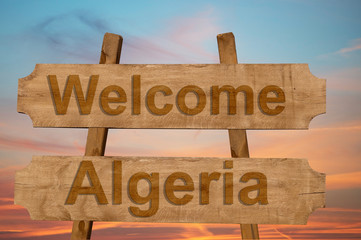 Welcome to Algeria sing on wood background