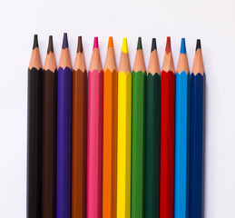 Colorful pencils isolated on a white paper background