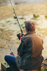 Senior man fishing on a freshwater lake 
