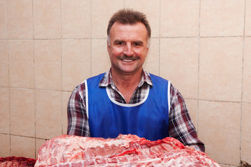 butcher with a pig carcass