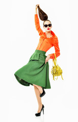 Fashion girl model posing on white background in the studio. Ful