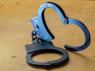 Handcuffs,and money.The concept of crime and punishment.