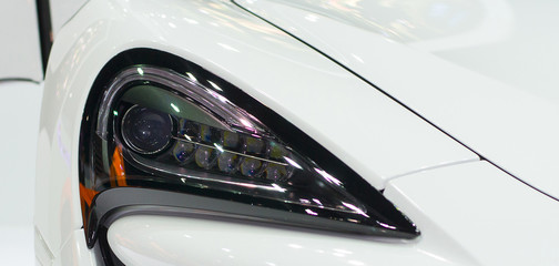 Headlight of the bronze car