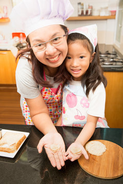 Asian mother and daughter enjoy making Sandwich, Sandwich making
