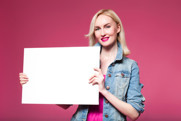 Shopping woman holding shopping bags on pink background . white