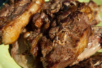 Roast leg of lamb. Shallow DoF, focus in centre of image on herb.