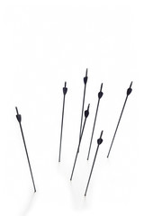 Arrows Hitting White Surface
