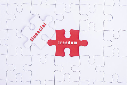 Missing white puzzle with financial, freedom word and copyspace