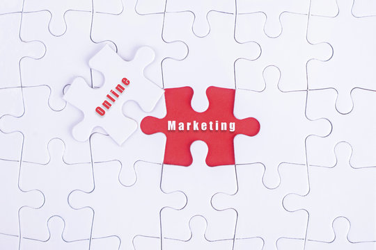 Missing white puzzle with Online, Marketing  word and copyspace