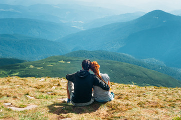 Hikers rest on the mountain peak