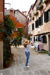 Enjoy sightseeing in the old town. Mature woman on vacation in Venice.