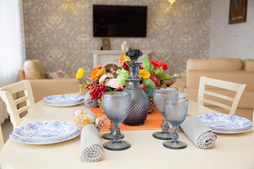 served table in bright kitchen-living room