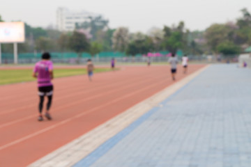 Fototapeta premium Blurred background of a man jogging on track