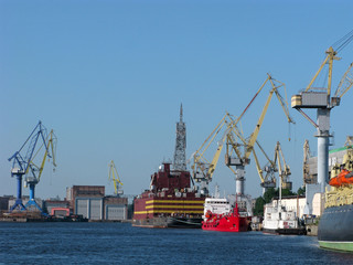 Cargo port with cargo handling cranes, warehouses and ships