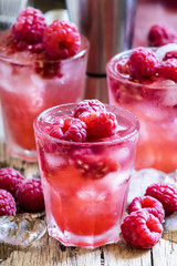 Alcoholic cocktail with fresh raspberry, liqueur, vodka and ice