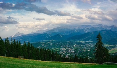 Panorama of Tatra Mountains and Zakopane from Gubalowka Hill at dusk, Poland