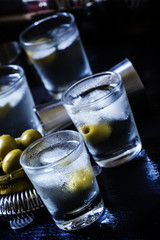 Alcoholic cocktail with dry white vermouth, green olives, vodka