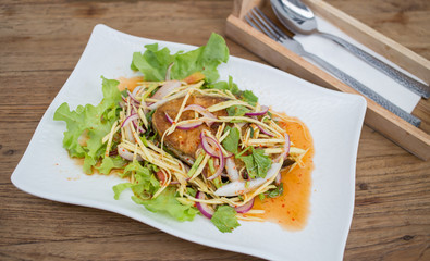 Fillet topped with a spicy dressing.