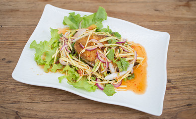 Fillet topped with a spicy dressing.