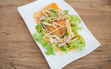Fillet topped with a spicy dressing.