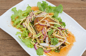 Fillet topped with a spicy dressing.