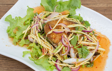 Fillet topped with a spicy dressing.