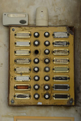 weathered doorbell panel