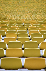 Obraz premium Green Stadium seating in rows from behind