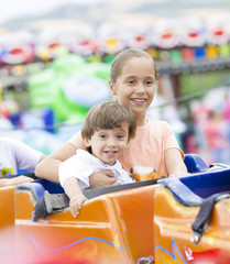 Obraz premium Happy children having fun riding