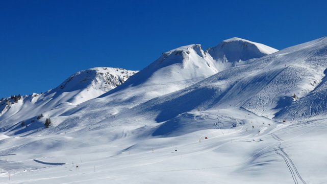 Snow covered mountains and ski slopes, ski area Stoos