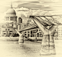 Millennium bridge crossing and St Paul's Cathedral in London