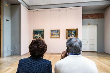 visitors in the Museum with audio guide