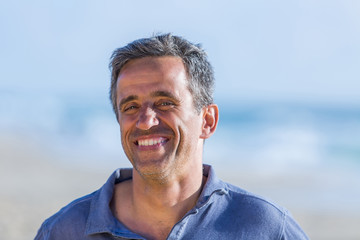 portrait of mid aged man on the beach
