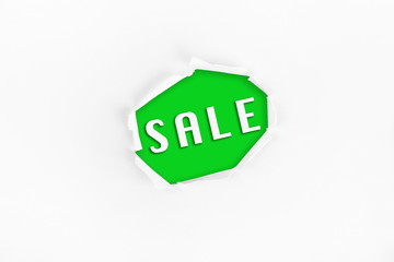  Torn paper with a SALE word on green  background