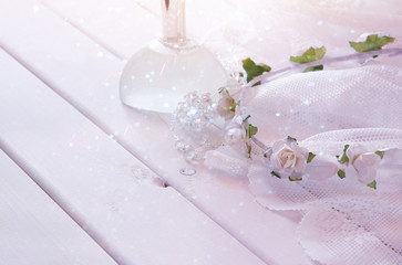 Dreamy photo of crystal necklace, tiara and perfume bottle