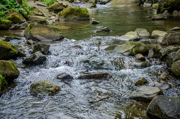 Mountain river with waterfall and rocks at national park in the Skole Beskids near Lviv