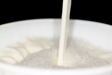 milk splash on black background