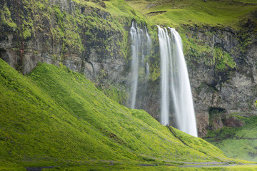waterfall between two hills in Iceland