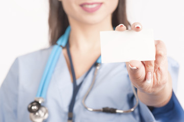 Doctor holding blank business card.