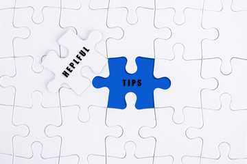 Fototapeta premium Helpful Tips concept on puzzle.