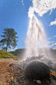 Flowing well artesian groundwater in sunlight.