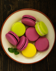Sweet and beautiful almond or French Macaron on white background, dessert.