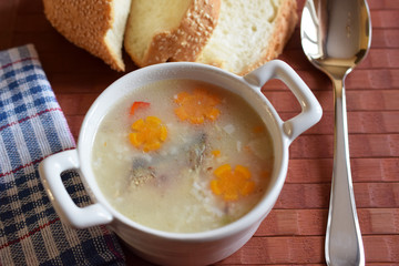 fish soup in a white plate