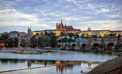 Fototapeta na wymiar Prague Castle, Charles Bridge and the embankment of Vltava River by summer evening, Prague