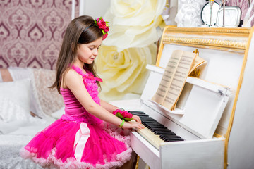 girl plays piano