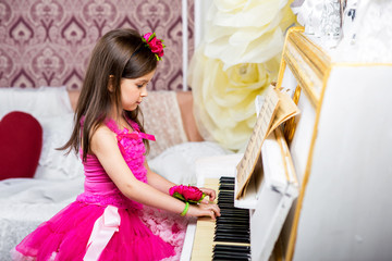 girl plays piano