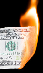 100 dollars burning on a black background