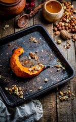 Baked pumpkin slices with honey and nuts,healthy dessert, autumn concept. Selective focus
