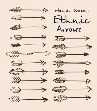 Set of ethnic arrows hand-drawn on a beige background for your design. Vector