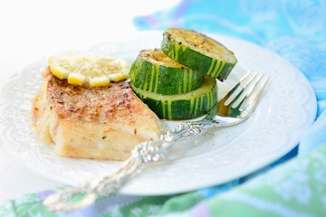 Grilled fish (cod) with zucchini.